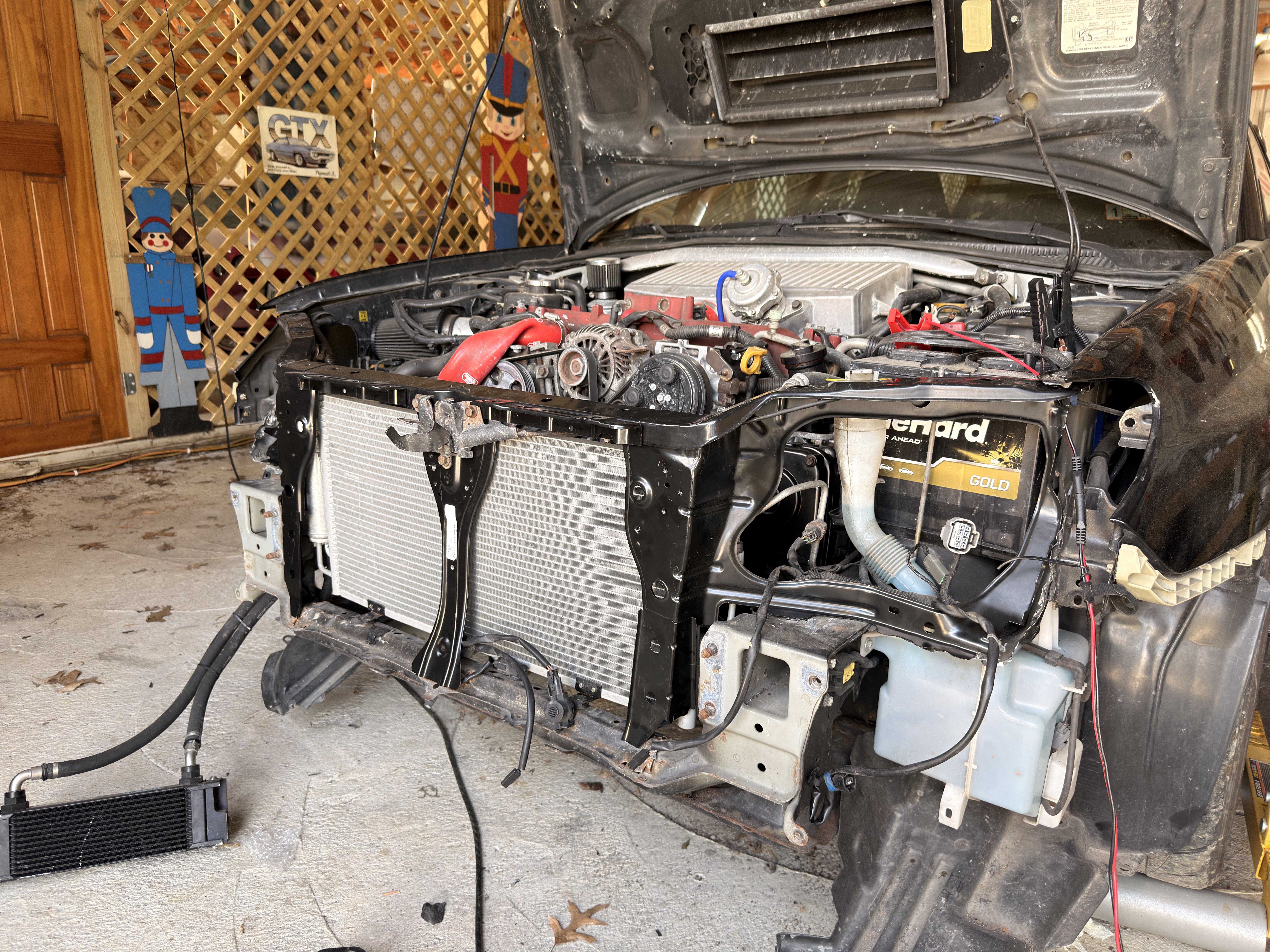 Installed the replacement front end pieces. (Left side radiator support, right side radiator support and lock support.)