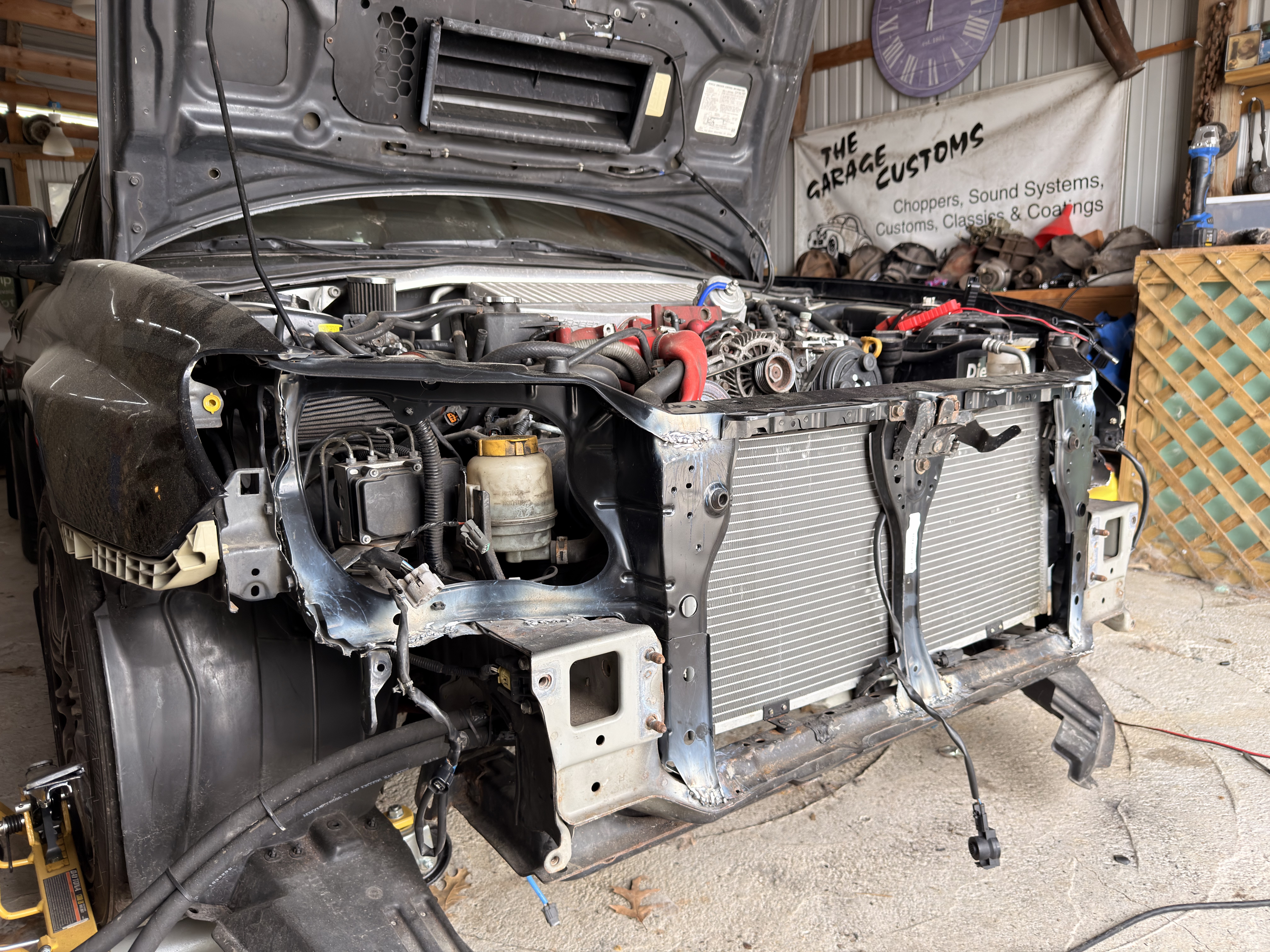 Got the front end welded back together. Fitment with the radiator looks a lot better!